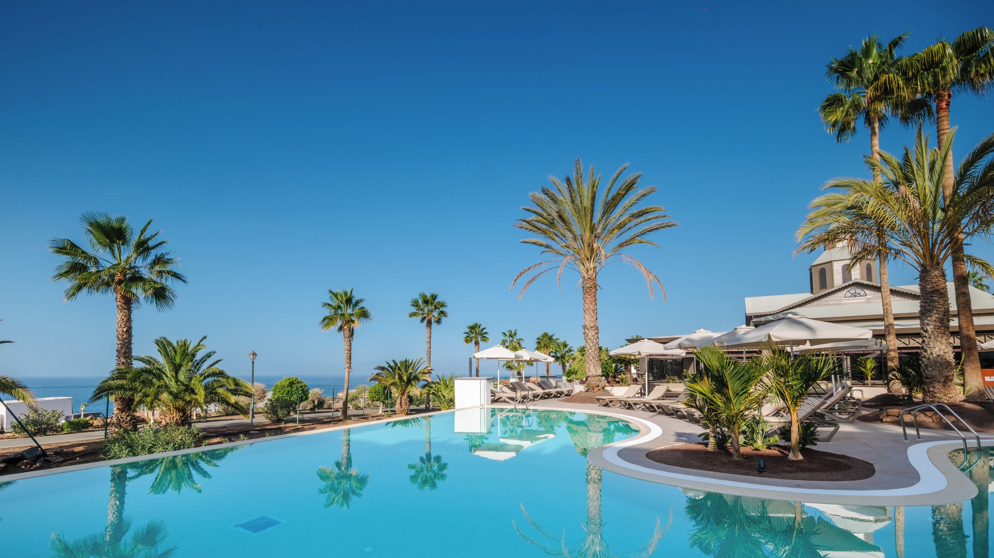 2 outdoor pools, open 9:00 AM to 6:00 PM, pool umbrellas, pool loungers