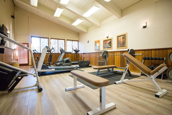 A gym with treadmills, elliptical machines, and weight benches. - Granlibakken Tahoe (Tahoe City)