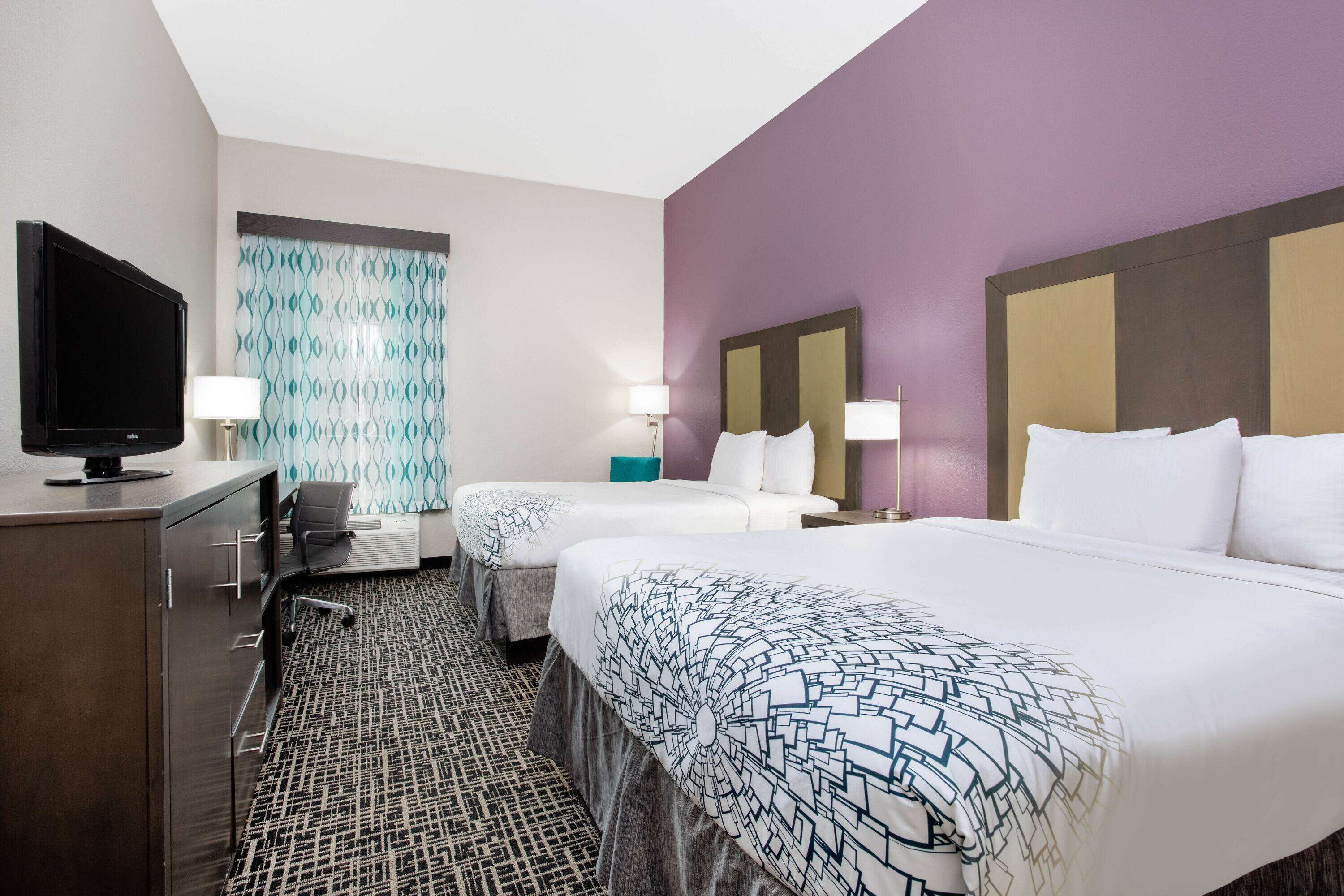 premium bedding, pillow-top beds, desk, laptop workspace