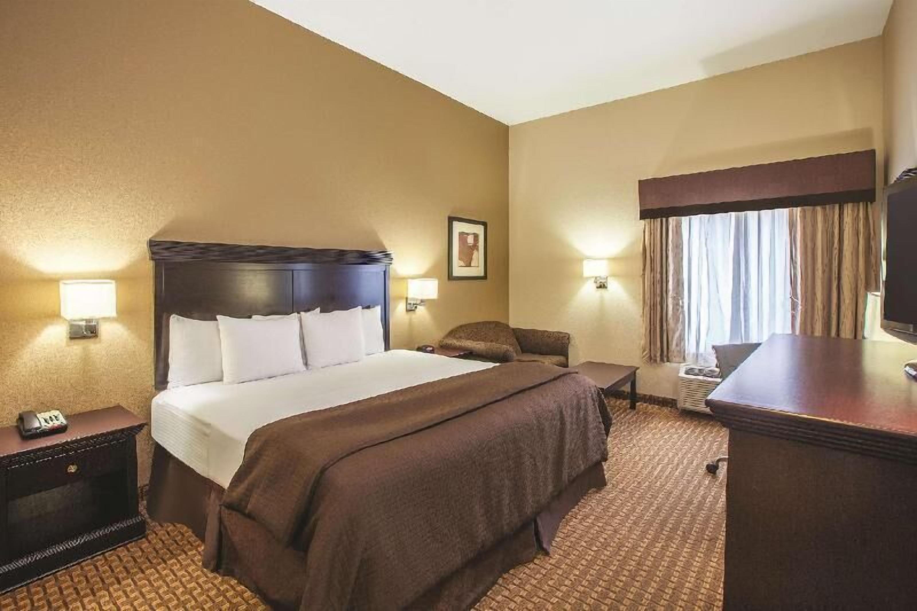 Premium bedding, pillow-top beds, desk, laptop workspace