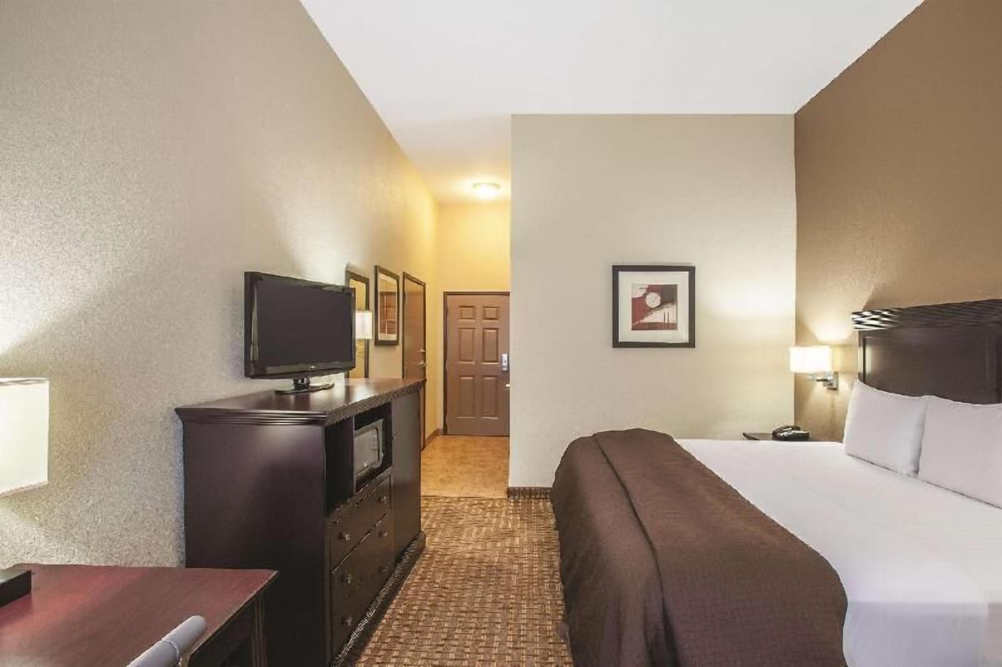 Premium bedding, pillow-top beds, desk, laptop workspace