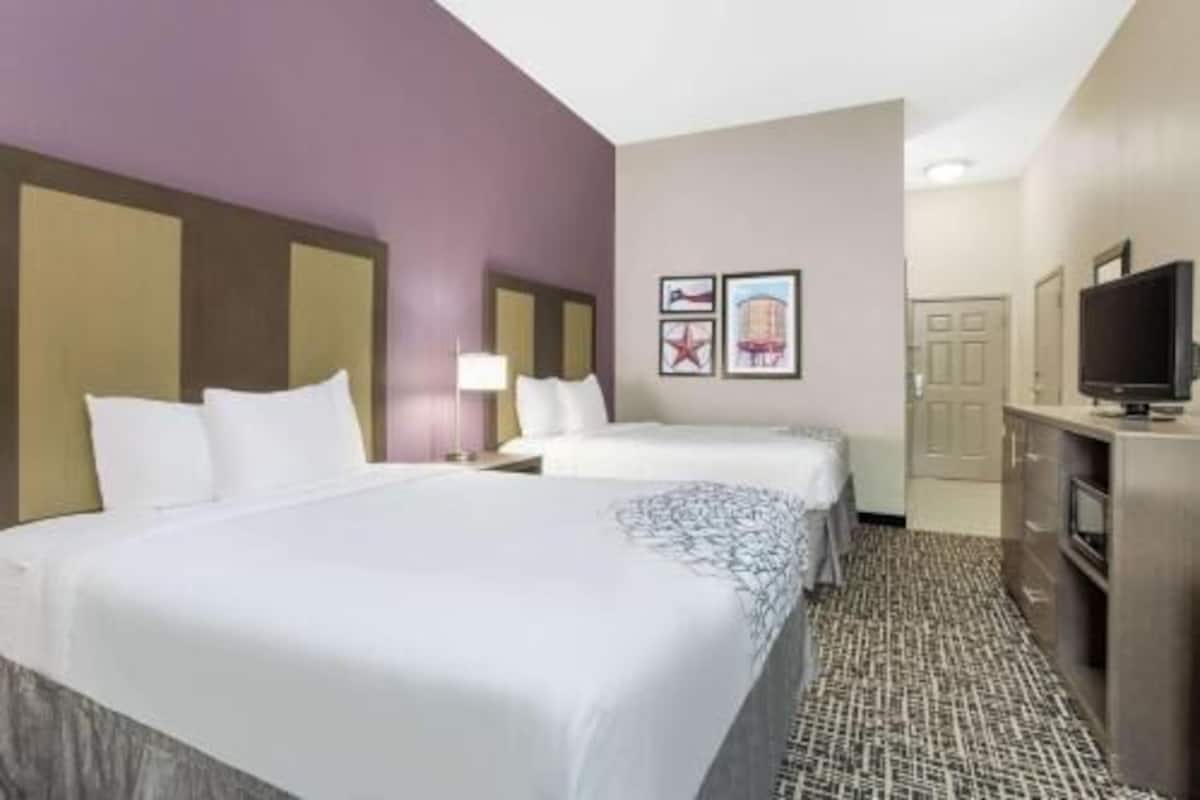 Premium bedding, pillow-top beds, desk, laptop workspace