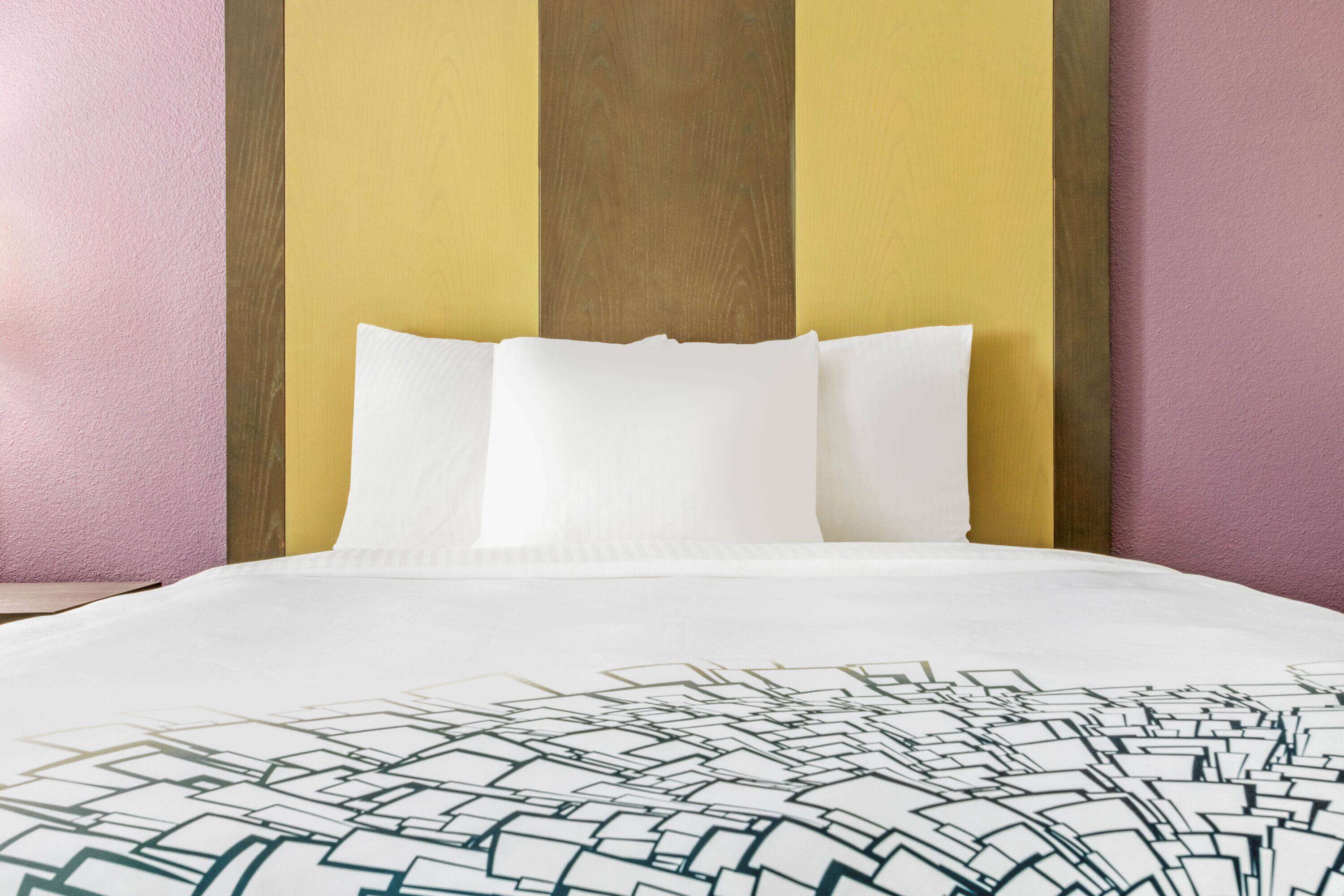 premium bedding, pillow-top beds, desk, laptop workspace