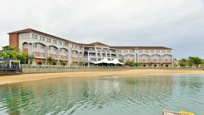 A hotel with multiple floors, a waterfront view, and a sandy beach area. - BON Hotel Waterfront Richards Bay (Richards Bay)