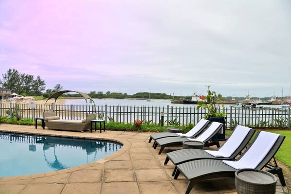 Outdoor pool, open 8:00 AM to 9:00 PM, pool loungers