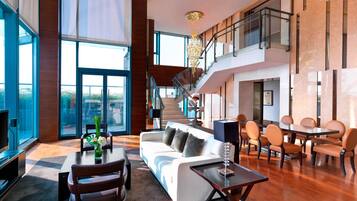 Presidential Suite, 2 Bedrooms | Living room | 32-inch flat-screen TV with cable channels, TV