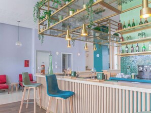 Enjoy a drink at the bar, where guests can sit and socialize.