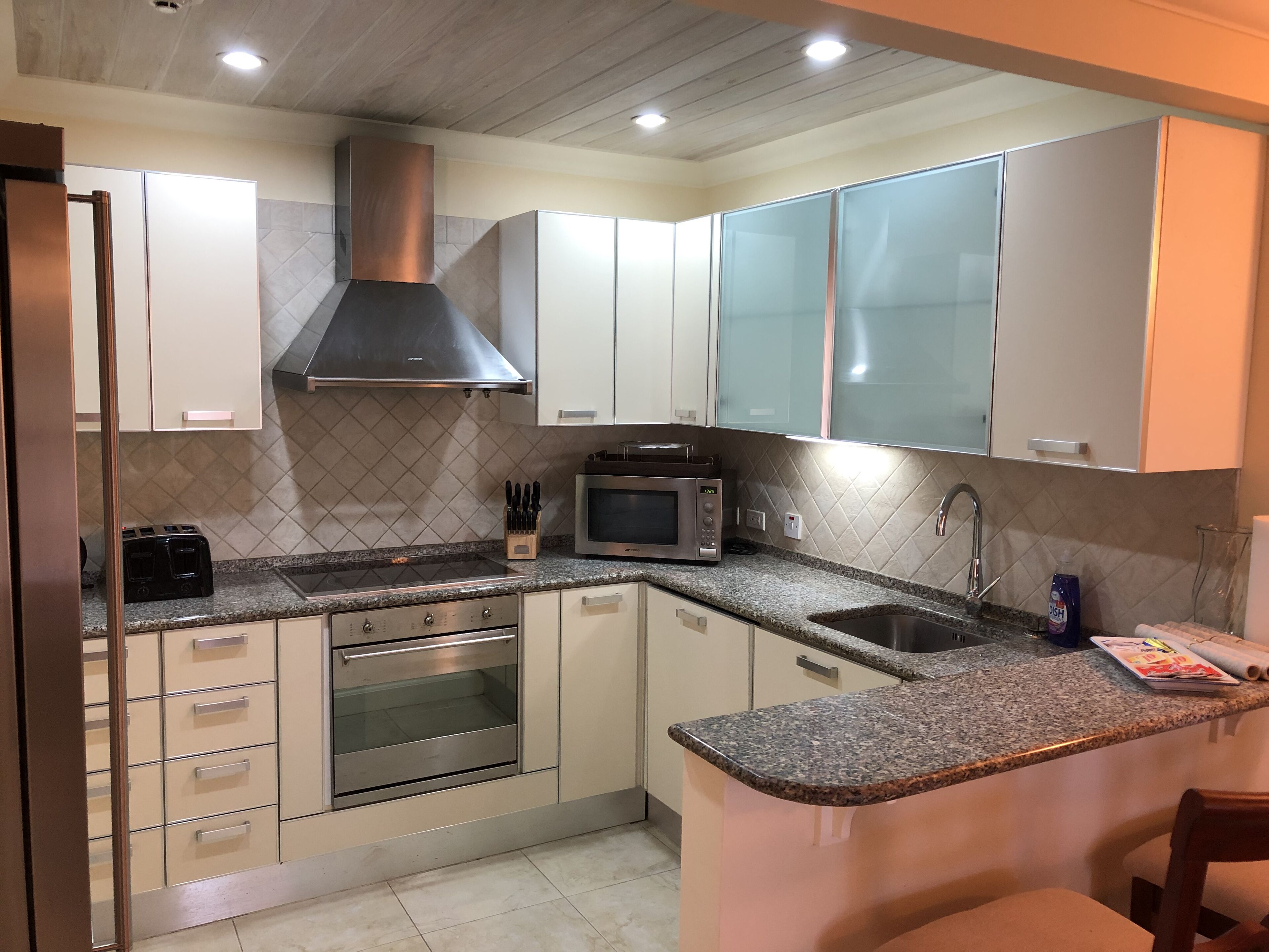 standard condo, 1 king bed, 2 bathrooms, partial ocean view | private kitchen | full-sized fridge, microwave, oven, stovetop