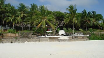 On the beach, white sand, beach towels, surfing