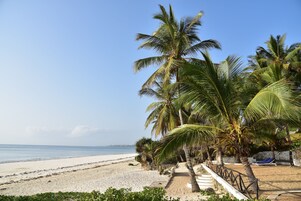 On the beach, white sand, beach towels, surfing