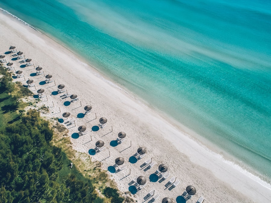 On the beach, white sand, beach umbrellas, beach towels
