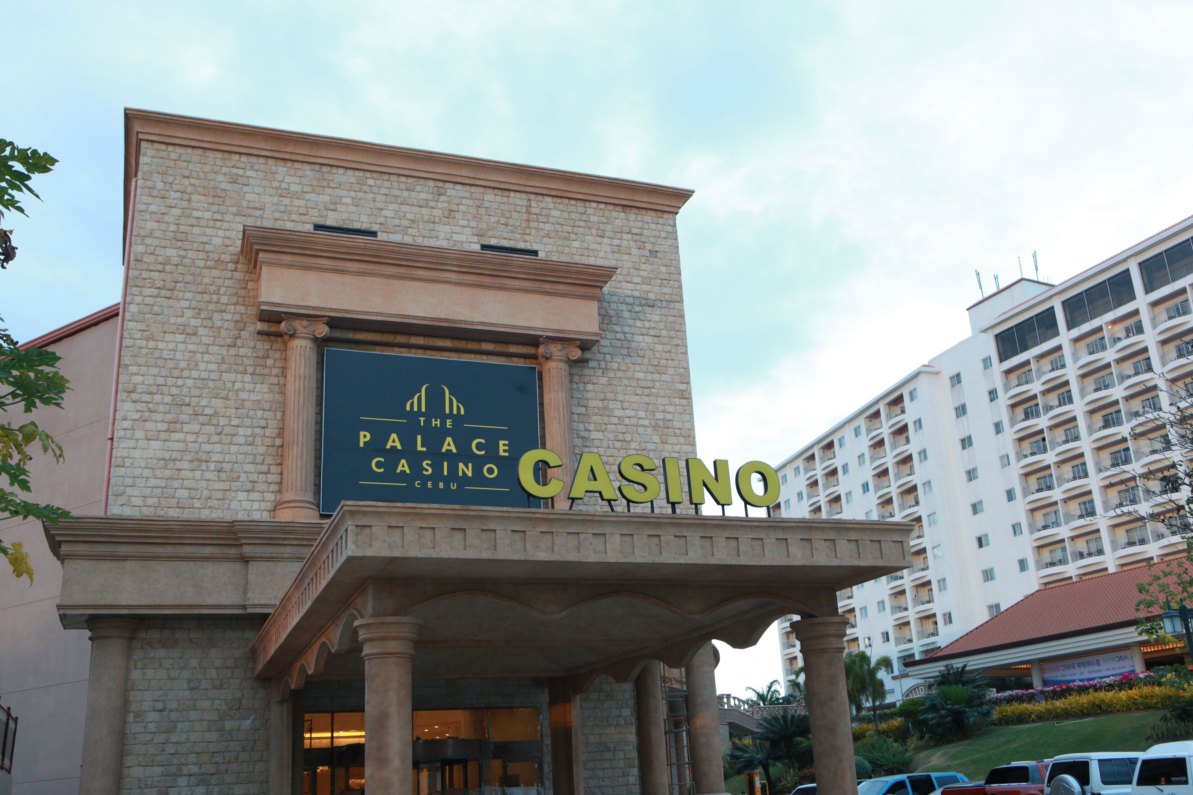 A building with a sign reading "Palace Casino Cebu."