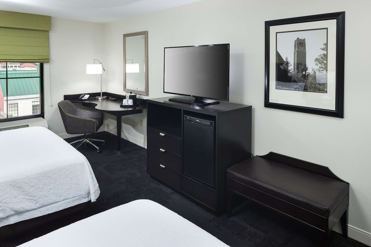 Premium bedding, desk, laptop workspace, blackout curtains