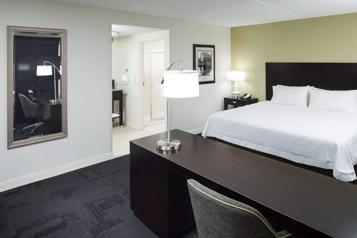 Premium bedding, desk, laptop workspace, blackout curtains