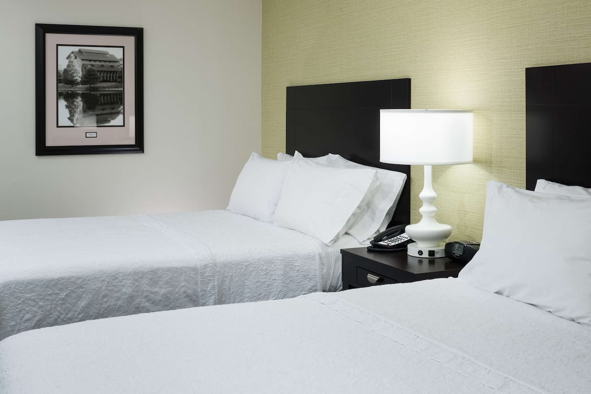 Premium bedding, desk, laptop workspace, blackout curtains