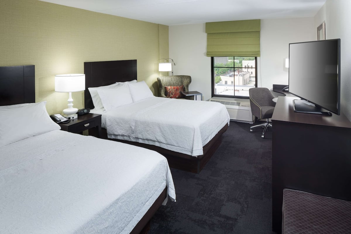 Premium bedding, desk, laptop workspace, blackout curtains