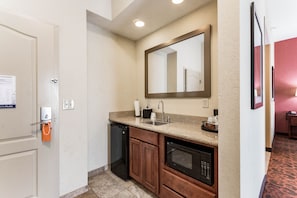 Enjoy a convenient kitchenette with a dishwasher, microwave, and sink.