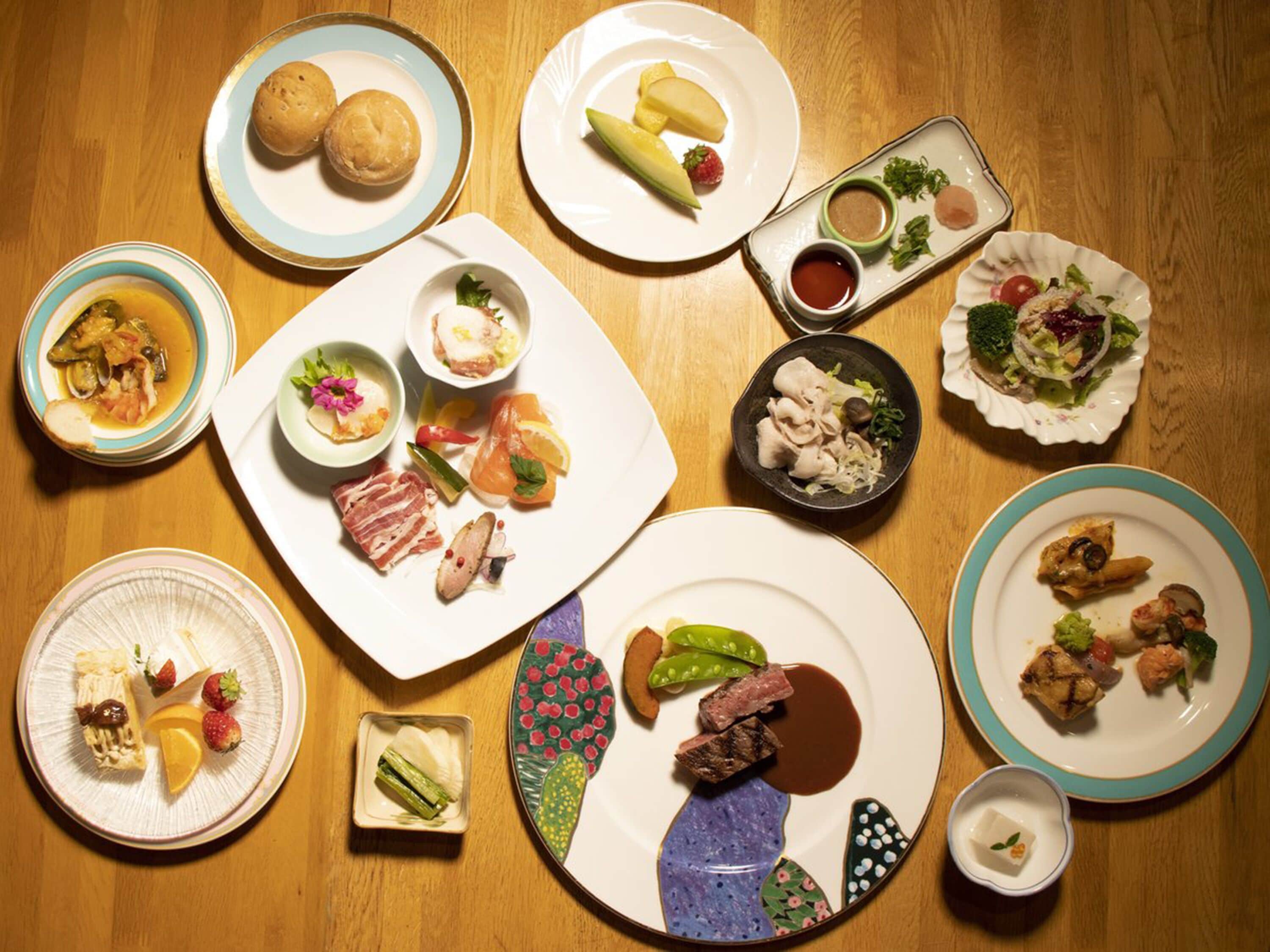 A variety of dishes on a wooden table.