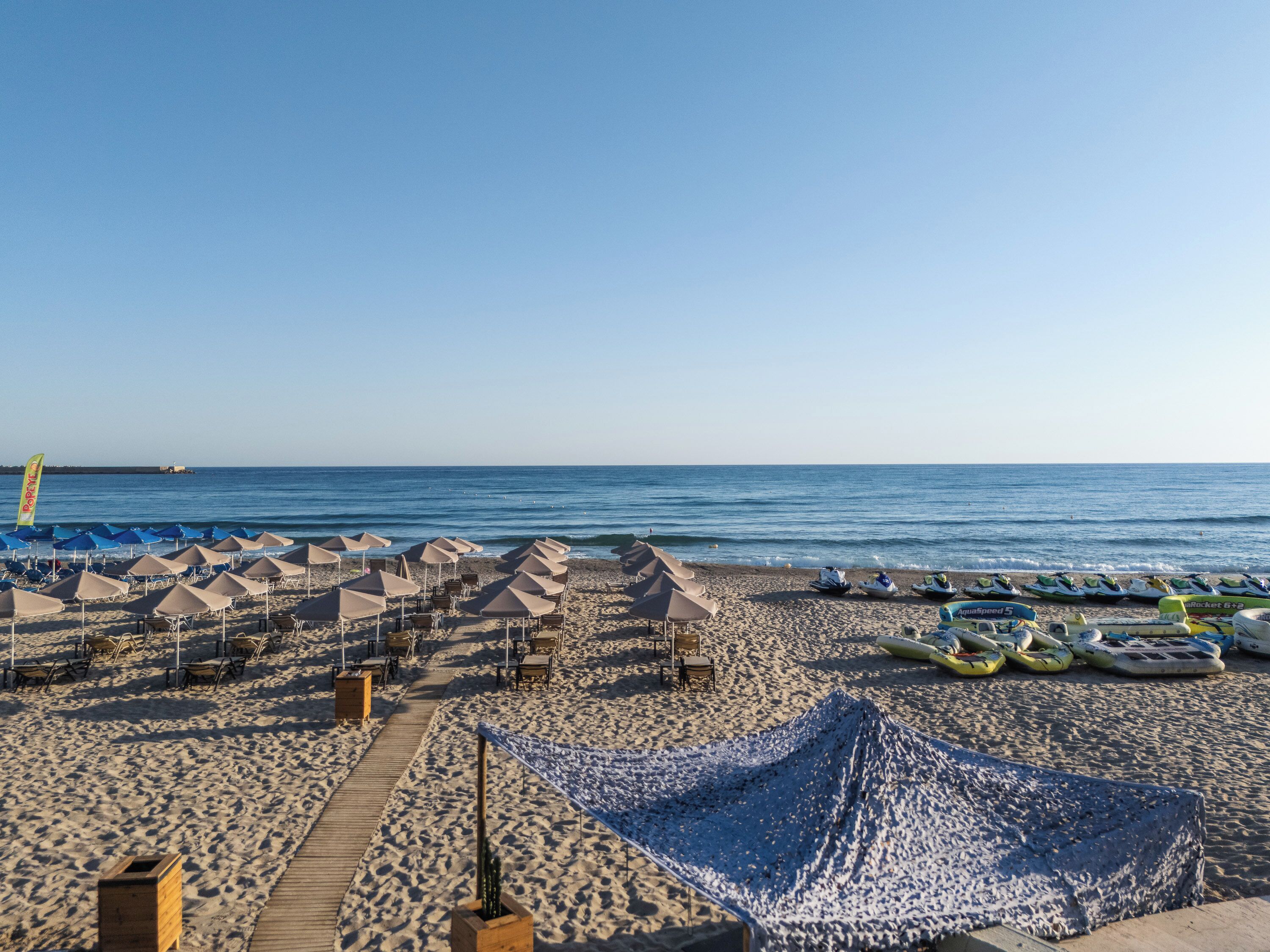 On the beach, sun-loungers, beach umbrellas, beach towels