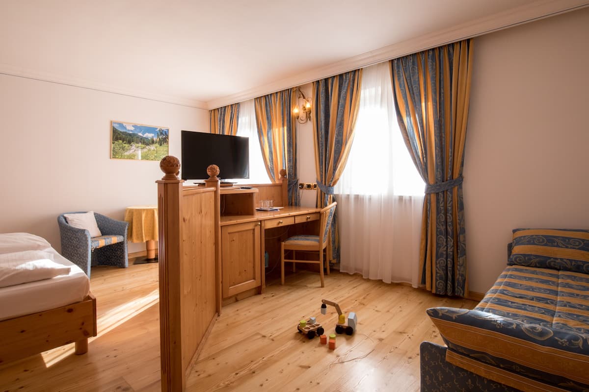 Habitación cuádruple familiar | Ropa de cama hipoalergénica, edredones de plumas, minibar y caja fuerte