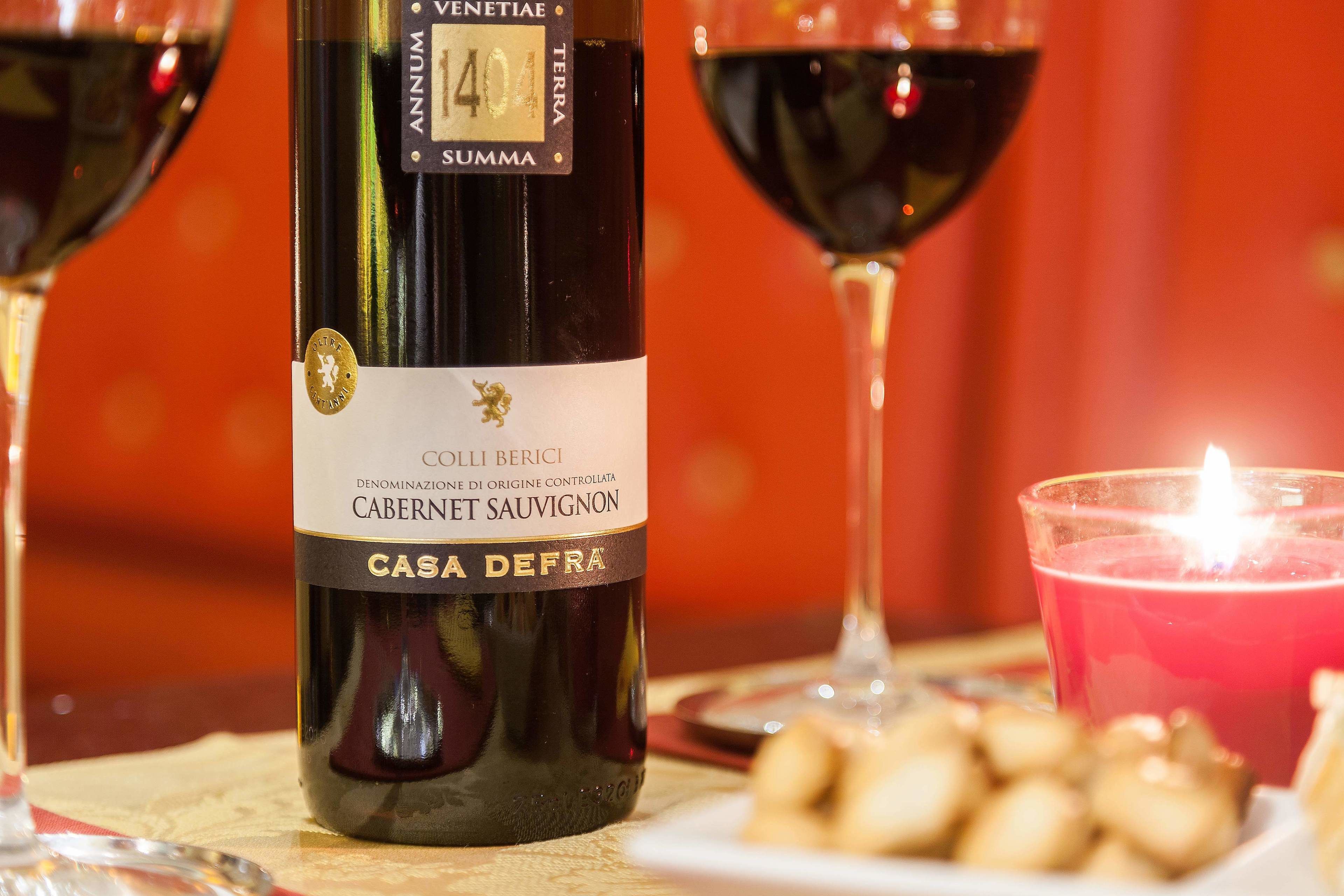 A bottle of wine with a label indicating it is a Cabernet Sauvignon from Colli Berici, with a number 404 on the label.