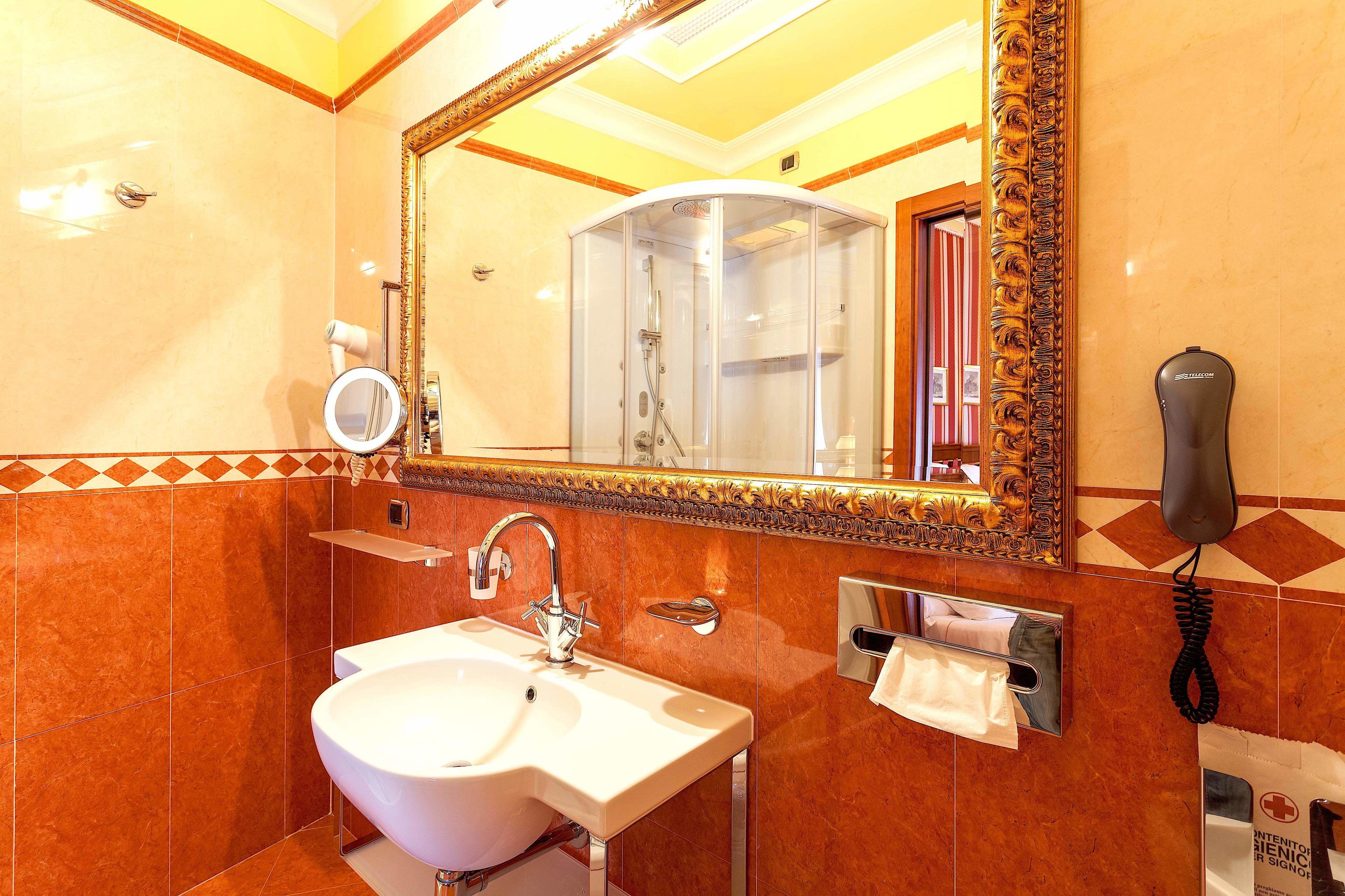 designer toiletries, hair dryer, towels, soap