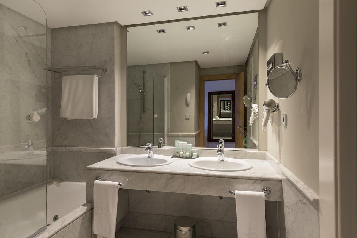 eco-friendly toiletries, hair dryer, bidet, towels