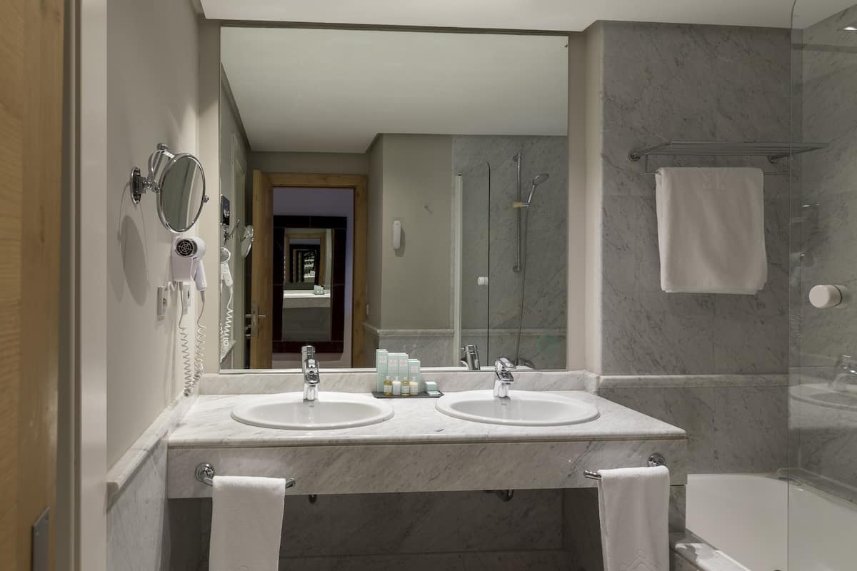 eco-friendly toiletries, hair dryer, bidet, towels