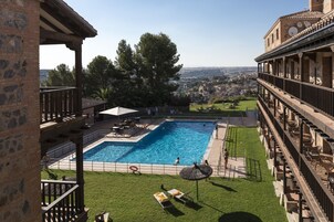 Seasonal outdoor pool, open 11:00 AM to 9:00 PM, pool umbrellas