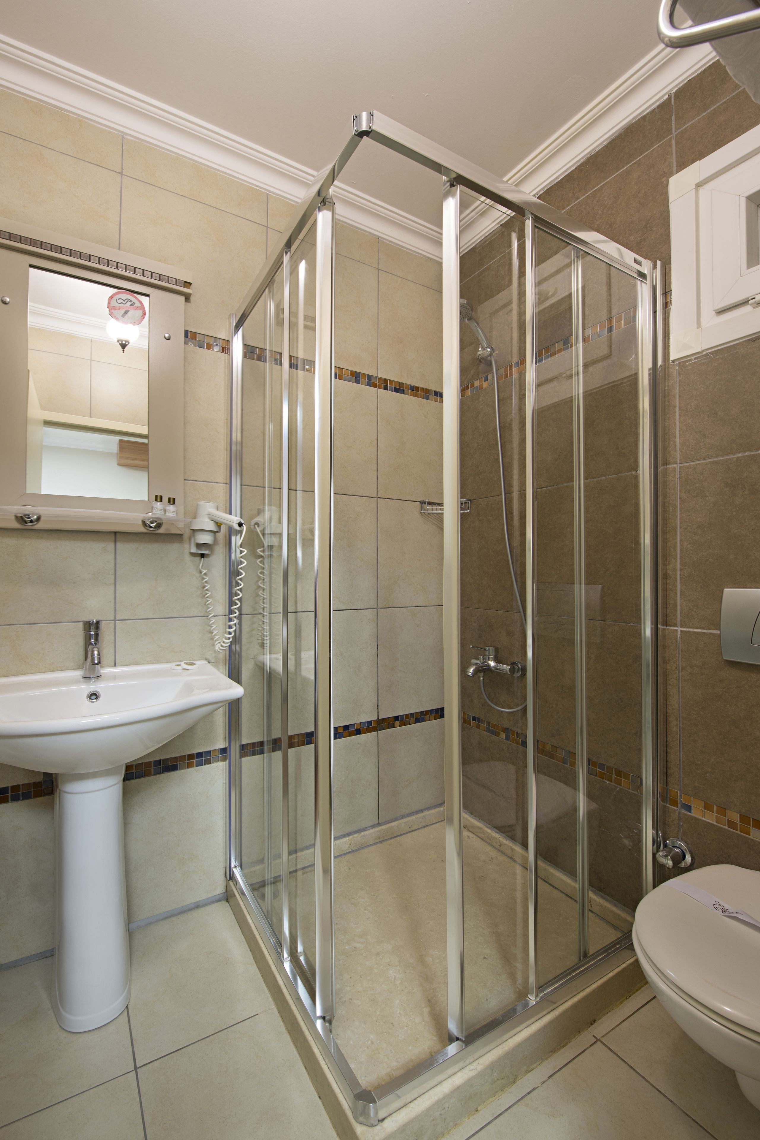 Shower, free toiletries, hair dryer, slippers