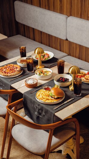A dining table set with various dishes, drinks, and a lamp. - Hotel Evsen - Adults Only (Istanbul)