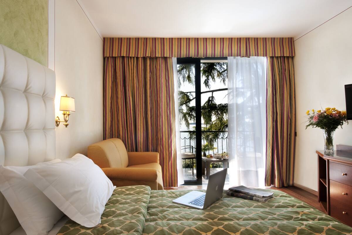 superior double room, lake view | premium bedding, minibar, in-room safe, desk