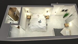 Un dormitorio con cama, mesitas de noche y una mesilla.