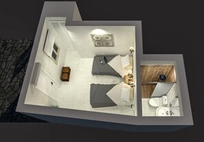 A modern hotel room with a bed, bedside table, lamp, and a small wooden cabinet. - Mina Town Hillside (Mykonos)