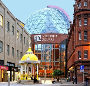 Victoria Square with a prominent glass dome and a yellow pavilion. - Cordia Serviced Apartments (Belfast)