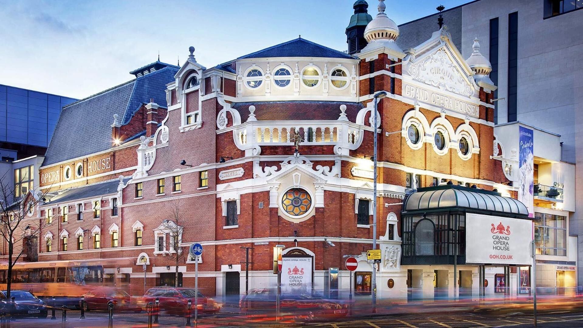 A historic opera house with classical architecture, including ornate facades and large windows.