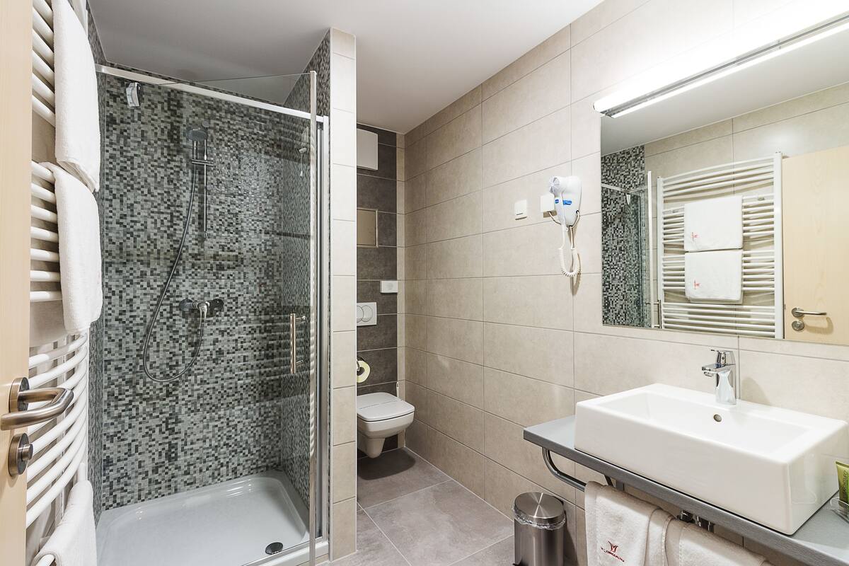 spa premium room | bathroom | shower, hair dryer, bathrobes, slippers
