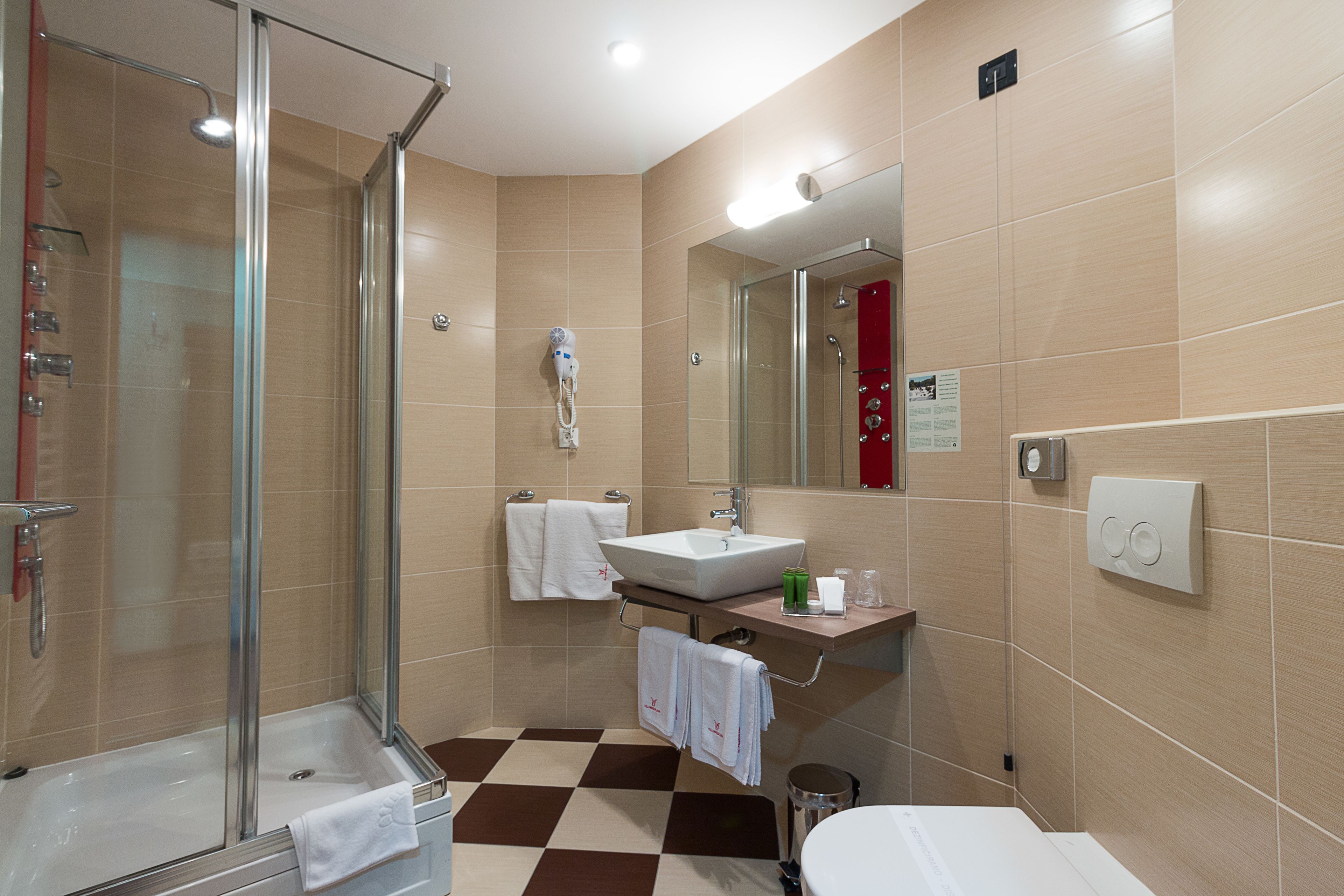 spa luxury suite | bathroom | shower, hair dryer, bathrobes, slippers