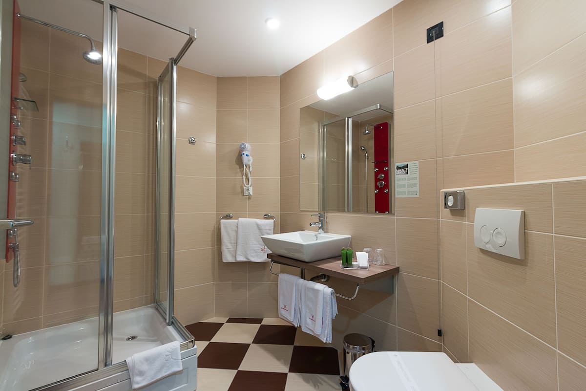 spa luxury suite | bathroom | shower, hair dryer, bathrobes, slippers