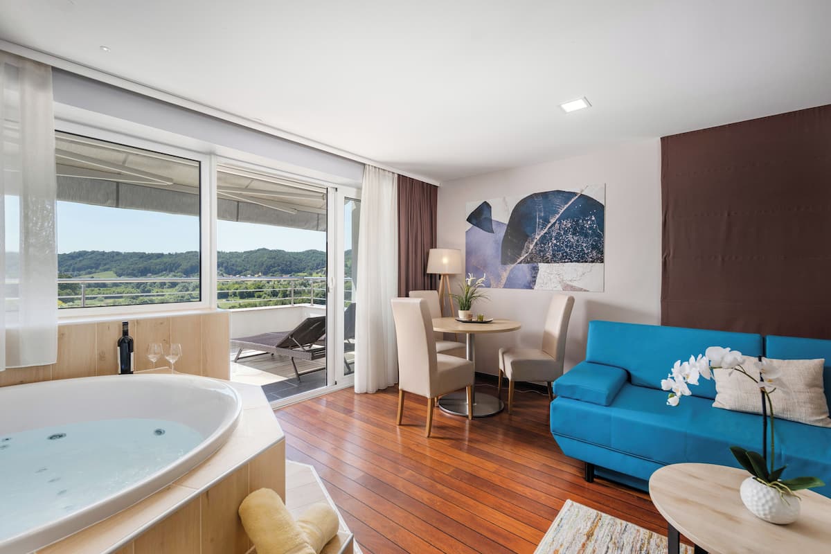 spa luxury suite | living area | 82-cm lcd tv with satellite channels, tv