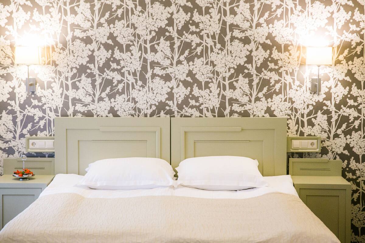 suite, sauna, city view | hypo-allergenic bedding, minibar, in-room safe, individually decorated