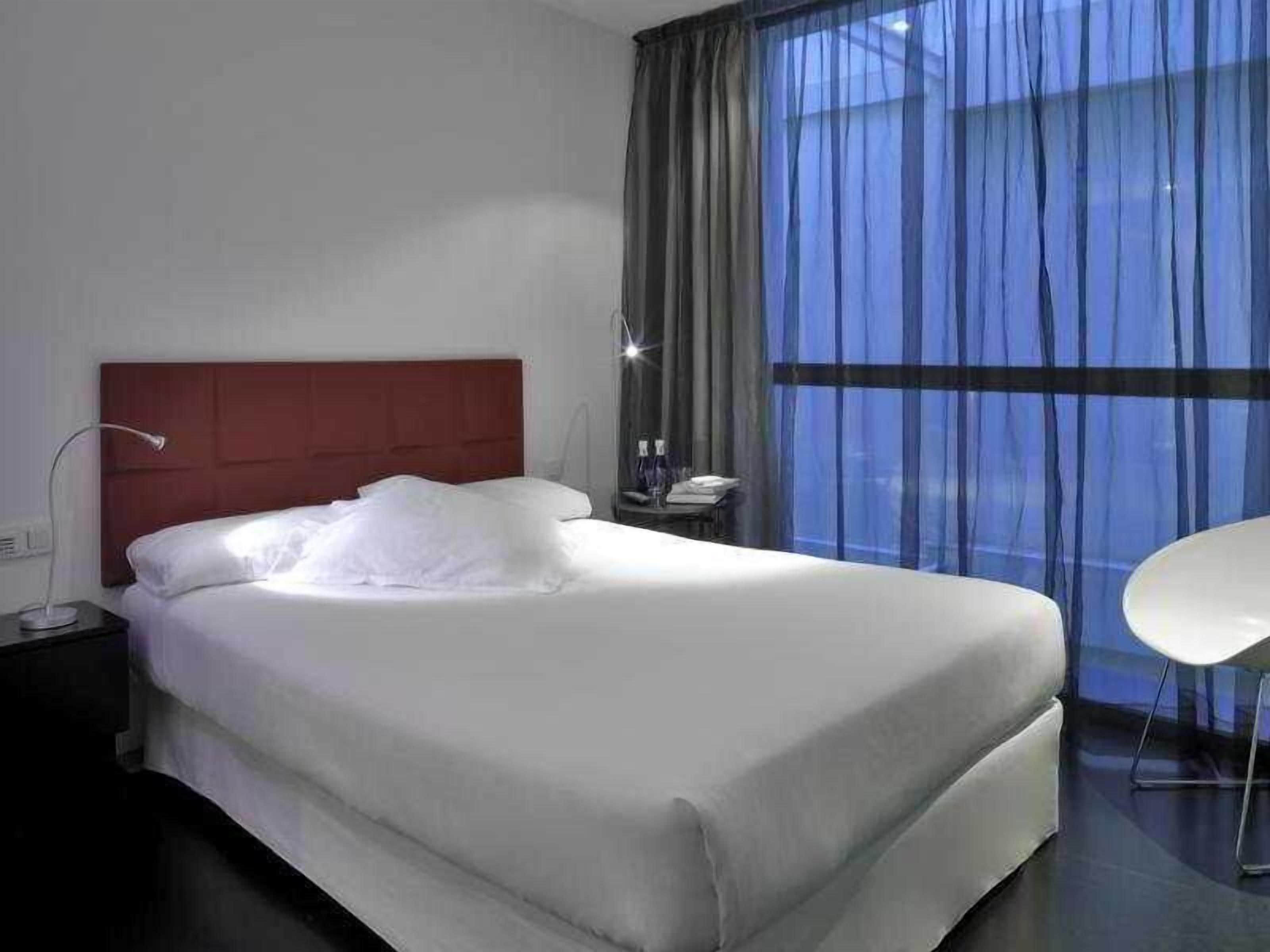 Down comforters, blackout drapes, iron/ironing board, free WiFi