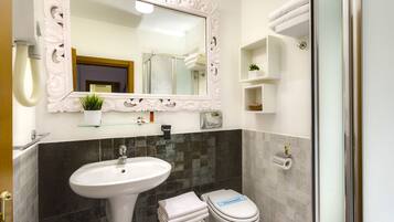 Shower, free toiletries, hair dryer, towels