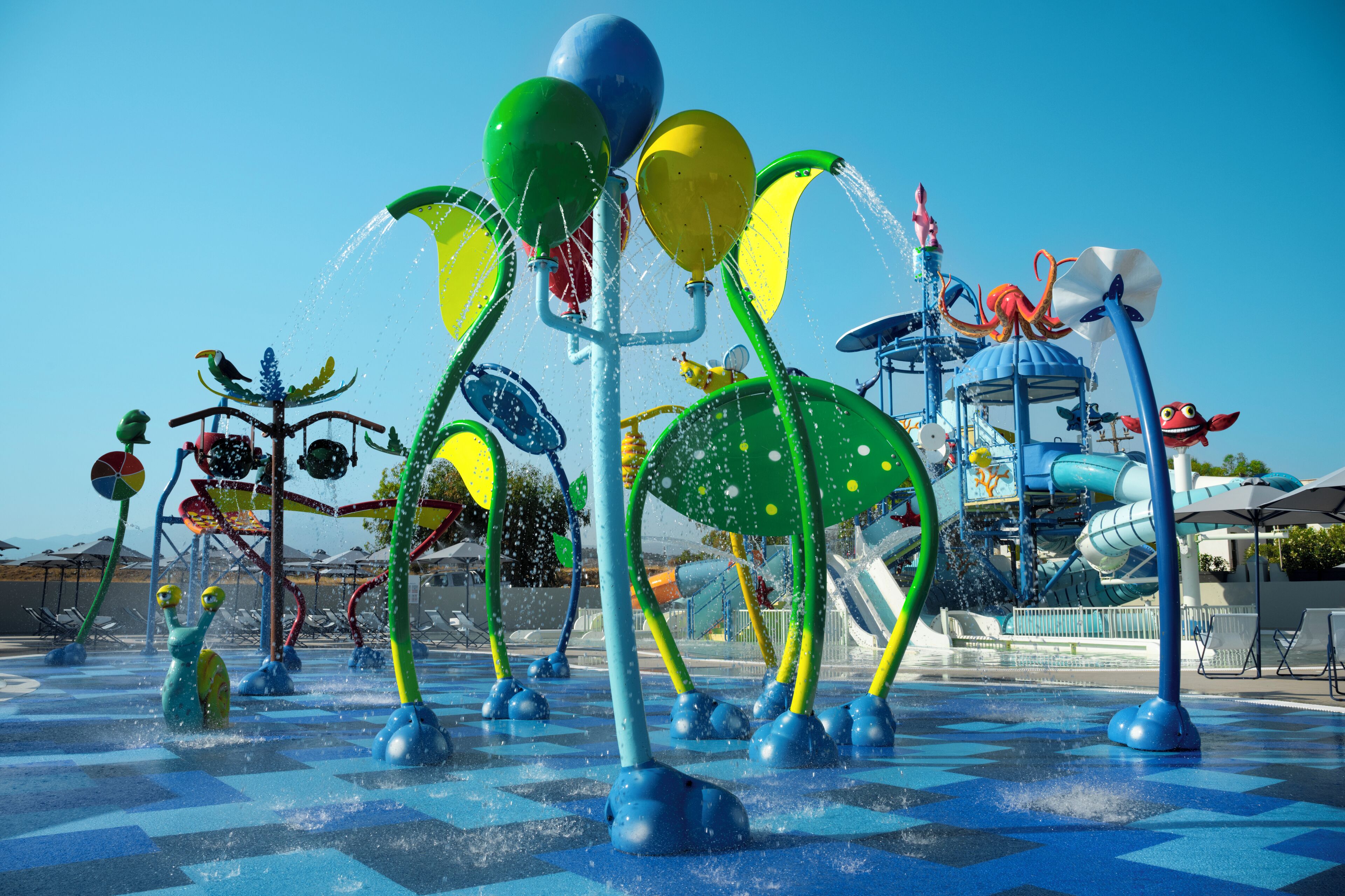A water park with various water features and play structures.