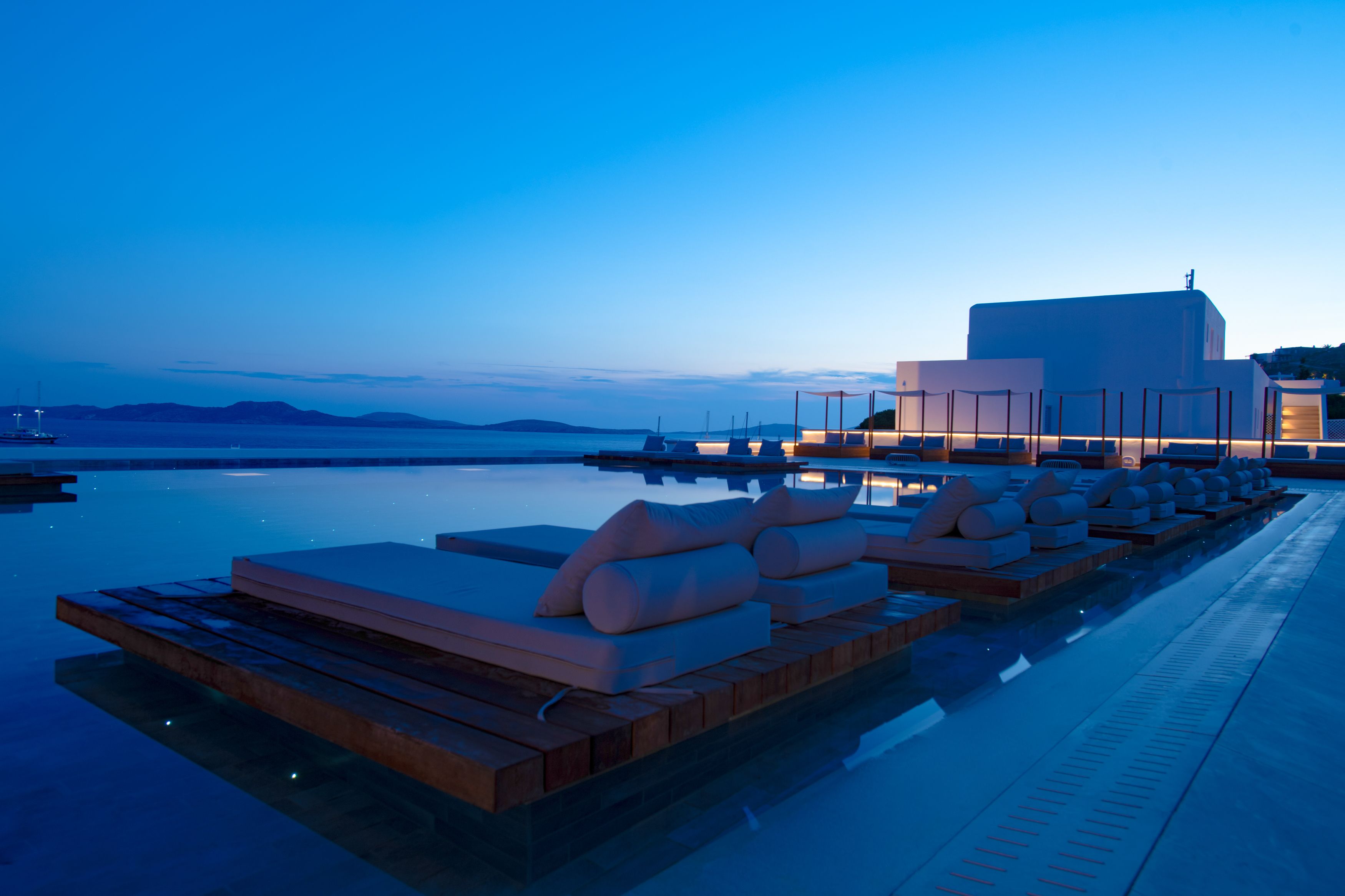 outdoor pool, open 10:30 am to 8:00 pm, pool umbrellas, pool loungers