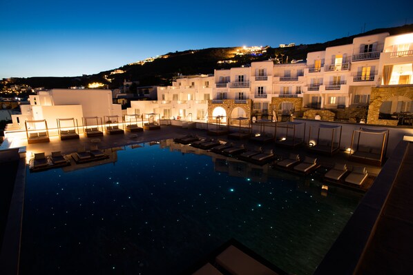 Outdoor pool, open 10:30 AM to 8:00 PM, pool umbrellas, pool loungers