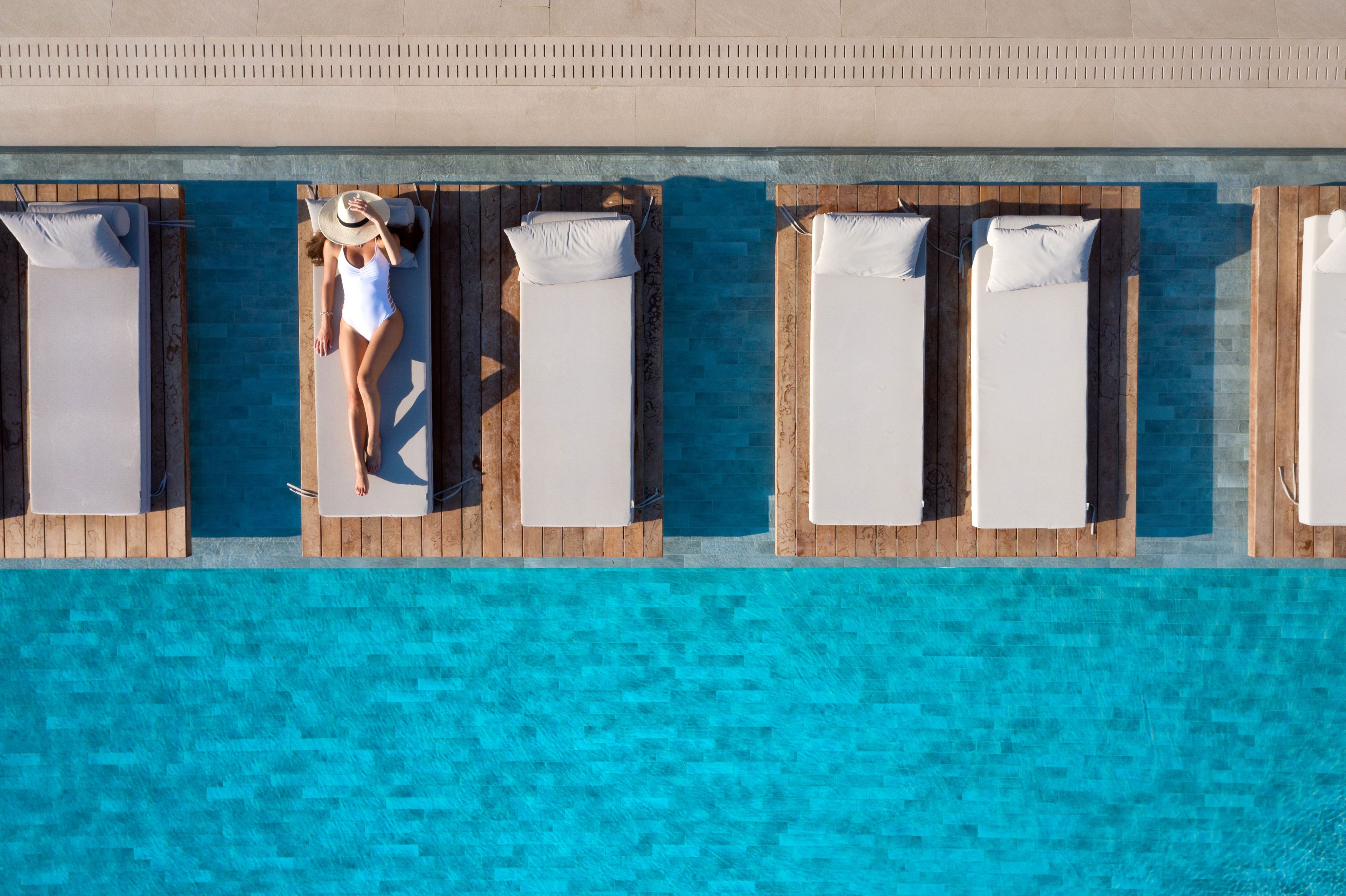 outdoor pool, open 10:30 am to 8:00 pm, pool umbrellas, pool loungers