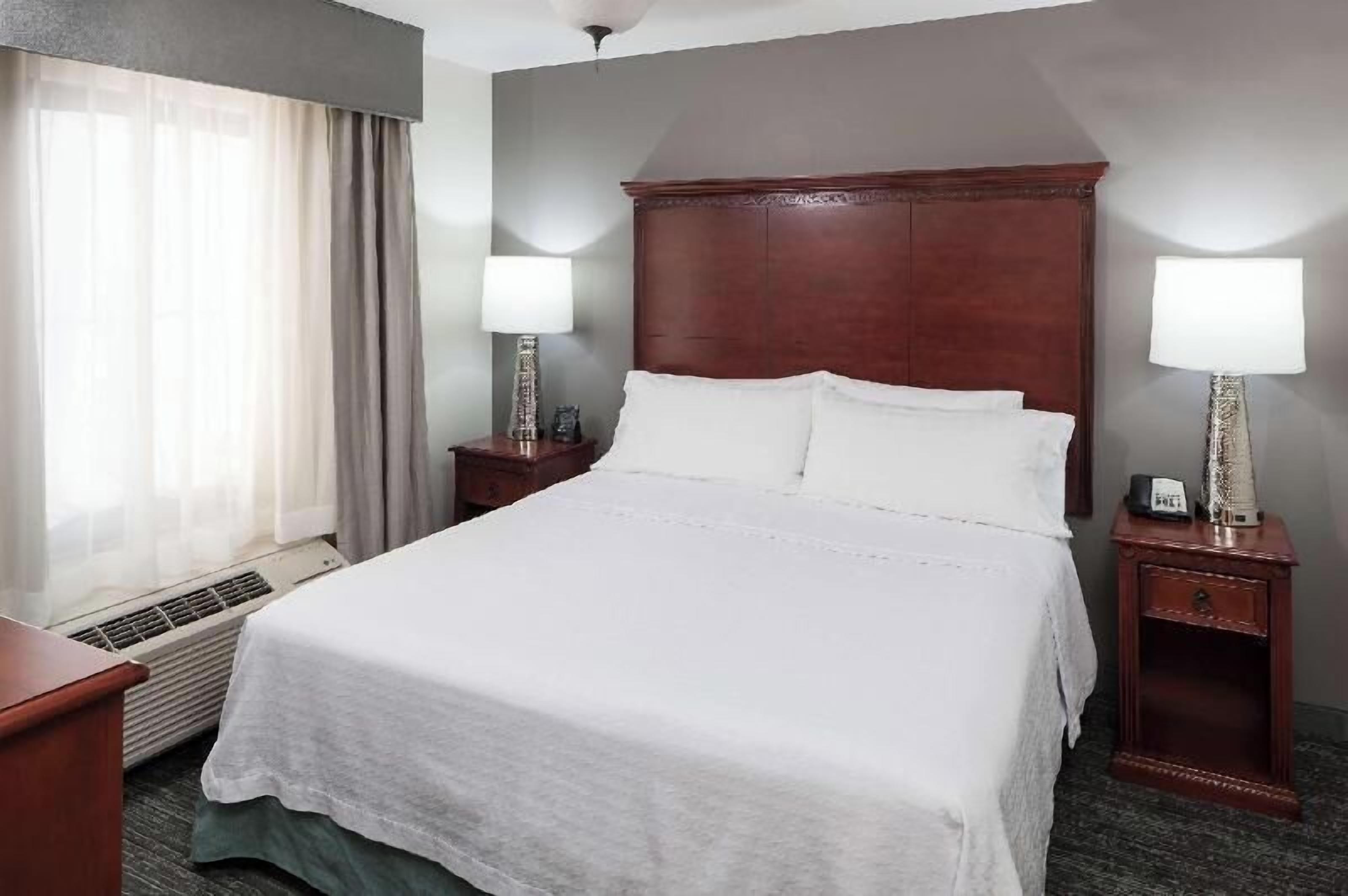 Premium bedding, pillowtop beds, laptop workspace, blackout drapes