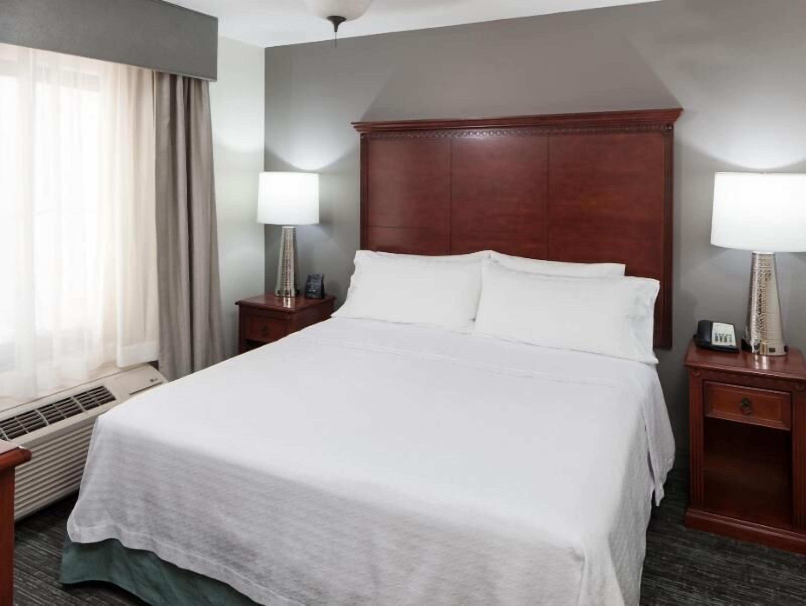 Premium bedding, pillowtop beds, laptop workspace, blackout drapes