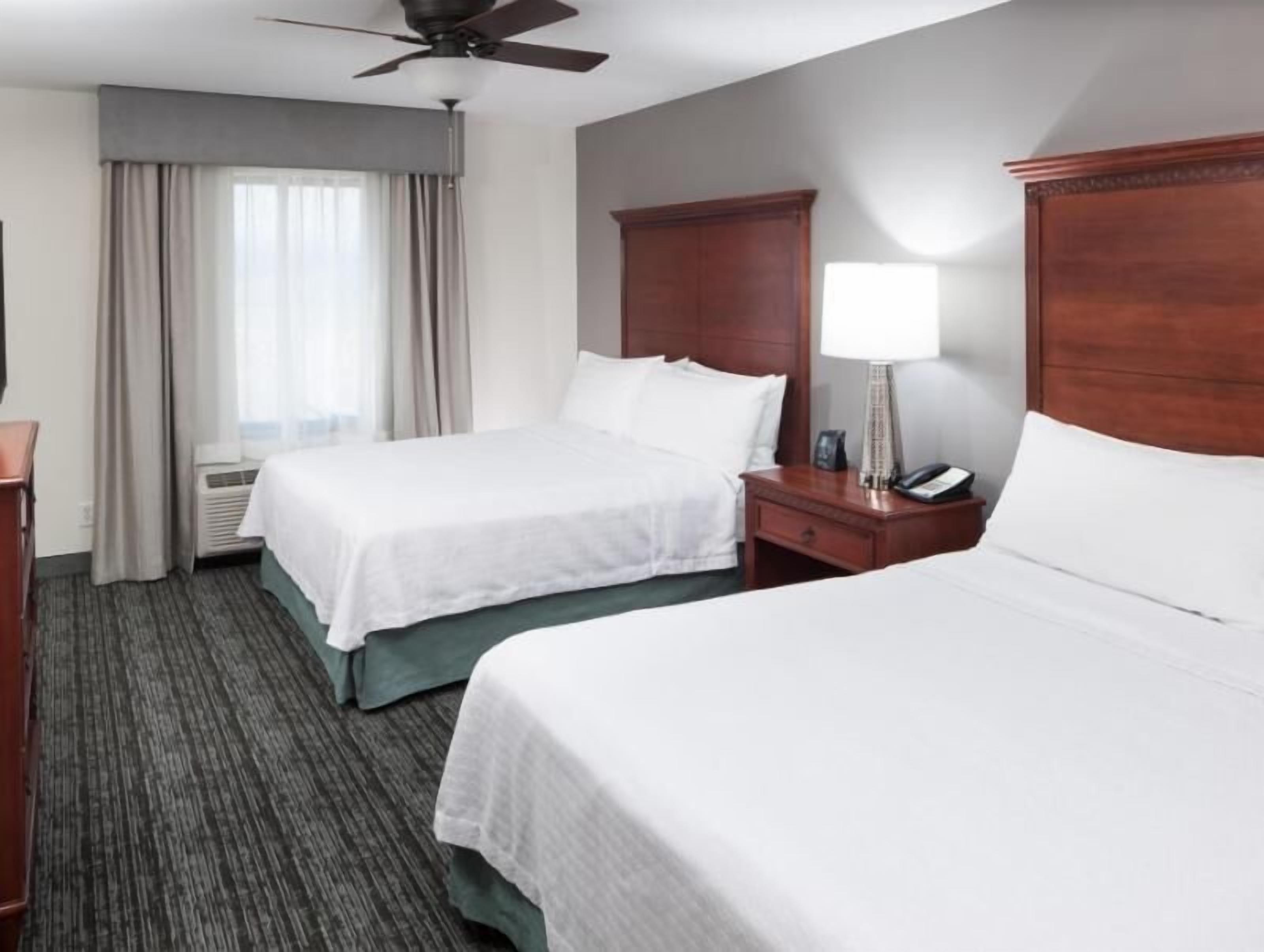 Premium bedding, pillowtop beds, laptop workspace, blackout drapes